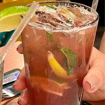 Puerto Vallarta - a person holding a drink - Mexican Near Me - Middletown, Connecticut Puerto Vallarta - a person holding a drink - Mexican Near Me - Middletown, Connecticut