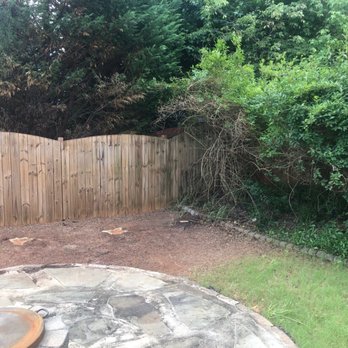 Daisy Tree Services - a fence and a fire pit - Tree Services Near Me Daisy Tree Services - a fence and a fire pit - Tree Services Near Me