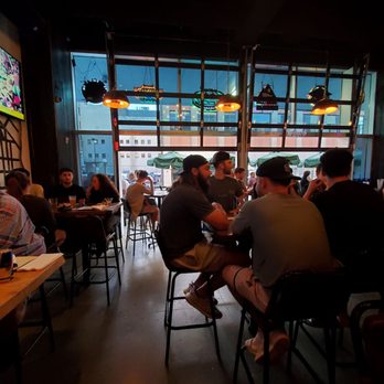 Pillbox Tavern - a group of people sitting at tables - Sports Bars Near Me - Saint Paul, Minnesota Pillbox Tavern - a group of people sitting at tables - Sports Bars Near Me - Saint Paul, Minnesota