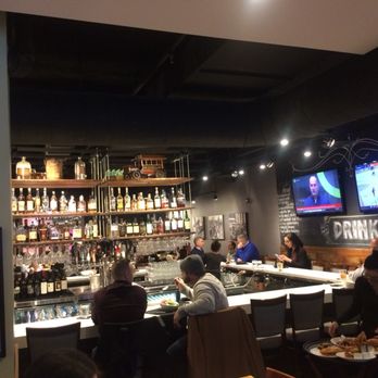 The Marq - Full large bar with comfortable chairs - New American Near Me - Chicago, Illinois