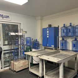 The Water Depot - Carts to load your jugs and transfer to your car, and the jugs for you to purchase!