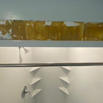 Mad City Windows & Baths of Minneapolis - Walls left damaged and crooked shower curtain. - Windows Installation Near Me - Roseville, Minnesota