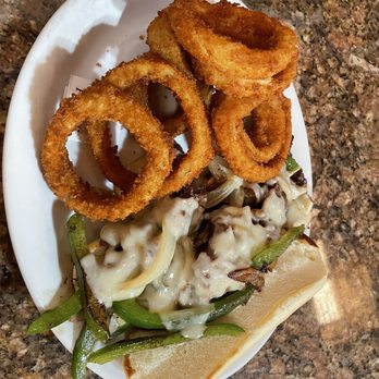 Volcano's Lava Rock Cafe - Philly cheese steak w onion rings - Breakfast & Brunch Near Me - Volcano, Hawaii Volcano's Lava Rock Cafe - Philly cheese steak w onion rings - Breakfast & Brunch Near Me - Volcano, Hawaii