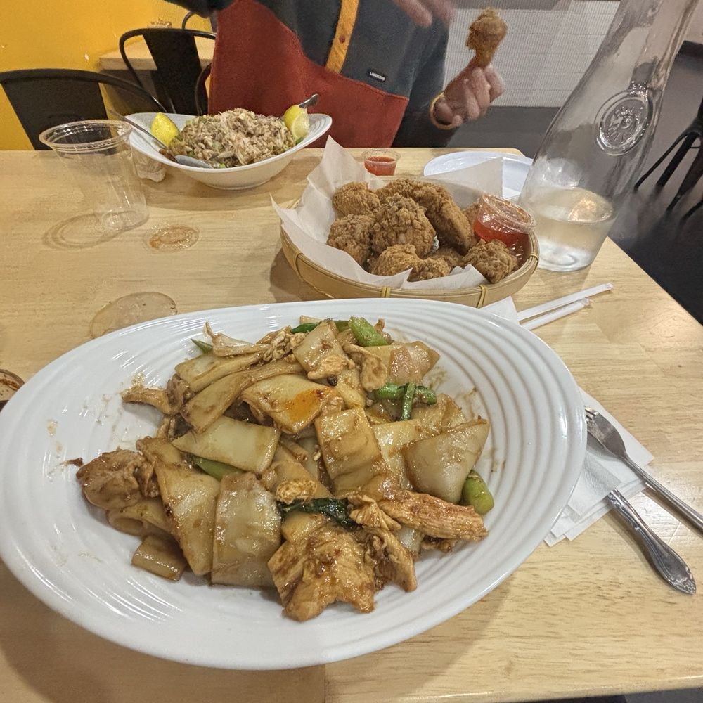 Pad See Ew, 12 Piece Chicken Wing and my friend got the crab fried rice Pad See Ew, 12 Piece Chicken Wing and my friend got the crab fried rice