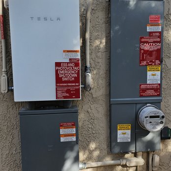 OC Solar - The Gateway next to the new upgraded panel. The panel upgrade required cutting out bigger hole in the stucco, seamlessly completed - Solar Installation Near Me - Irvine, California OC Solar - The Gateway next to the new upgraded panel. The panel upgrade required cutting out bigger hole in the stucco, seamlessly completed - Solar Installation Near Me - Irvine, California
