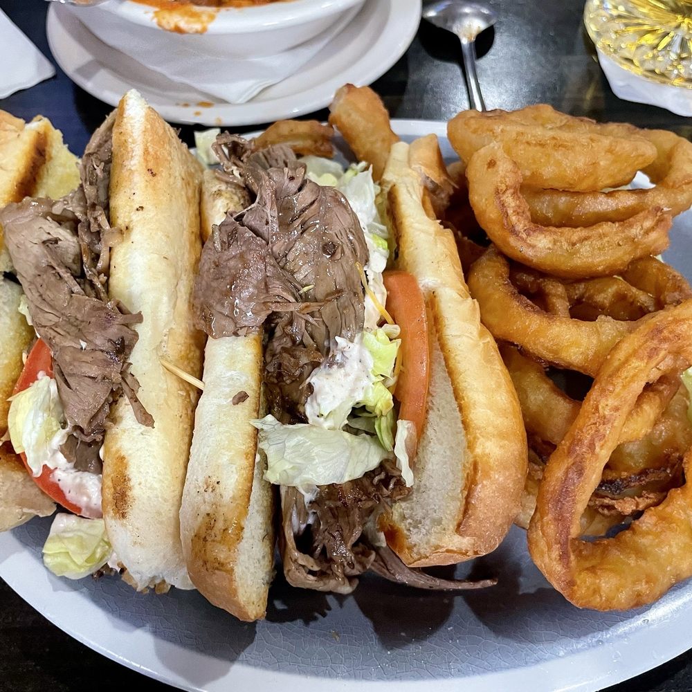 Off The Hook Sports Grill - Fair Haven Po Boy... more of a roast beef sandwich, but tasty, and there was a lot of of it. The onion rings were excellent. - New American Near Me - Ira Township, Michigan