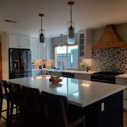 Build Legacy - Kitchen Cabinets, countertops, lighting and hand crafted vent hood.