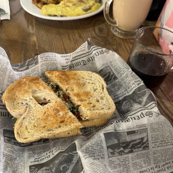The Daily Pressed - Light and Fit sandwich and black coffee in the foreground, omelet with potatoes and The Daily latte in the background - Italian Near Me - Akron, Ohio The Daily Pressed - Light and Fit sandwich and black coffee in the foreground, omelet with potatoes and The Daily latte in the background - Italian Near Me - Akron, Ohio