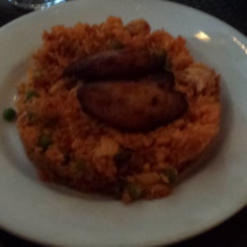 Blend - arroz con pollo- seasoned yellow rice, chicken, green peas, cilantro, & roasted peppers served w/ maduros - Latin American Near Me - Long Island City, New York Blend - arroz con pollo- seasoned yellow rice, chicken, green peas, cilantro, & roasted peppers served w/ maduros - Latin American Near Me - Long Island City, New York