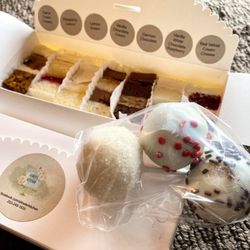 Ashley's Kitchen - Tasting boxes with seven rotating flavors. Buy two boxes and get 3 pop cakes free