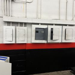 Northern Ky Ice Center - Fuse boxes not really closed along walkway behind seating.