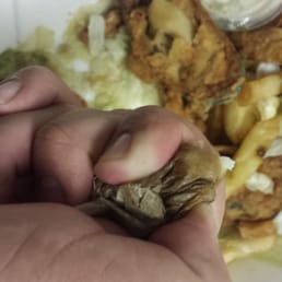 The oil from 1 french fry and underneath Jalea with french fries from chicken sandwich The oil from 1 french fry and underneath Jalea with french fries from chicken sandwich