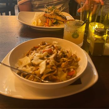 Tempo Kitchen & Bar - Blackened chicken pasta plate and a salmon plate. - New American Near Me - Gilroy, California