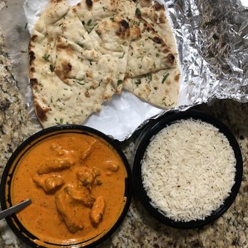 Tandoori Eats - Chicken Makhani, medium (9/10); Plain Basmati Rice (6/10); Garlic Naan (8/10). Would recommend! - Indian Near Me - Los Angeles, California