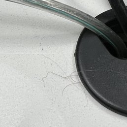 Dusty, hairy bedside table. Didn't get cleaned up when housekeeping came through to do a refresh.