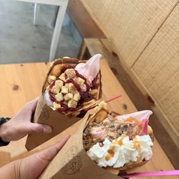 Left : Cheesecake Waffle cone- strawberry and black cherry yogurt. Right: caramel crunch waffle cone- strawberry and raspberry yogurt Left : Cheesecake Waffle cone- strawberry and black cherry yogurt. Right: caramel crunch waffle cone- strawberry and raspberry yogurt