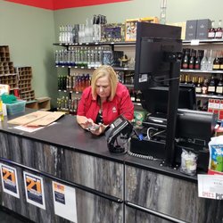 Spec's Wines, Spirits & Finer Foods - This cashier refused to even lookup from her phone to check me out. Told me to go to a different register.