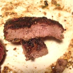 O'Charley's Restaurant & Bar - A grossly over done and over seasoned piece of meat! Ordered medium and received this.