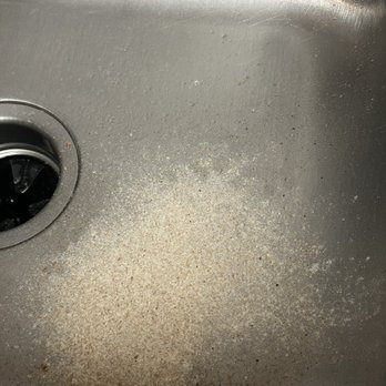 Pizza My Heart - Excess flour from bottom of pizza - Pizza Near Me - Dublin, California Pizza My Heart - Excess flour from bottom of pizza - Pizza Near Me - Dublin, California