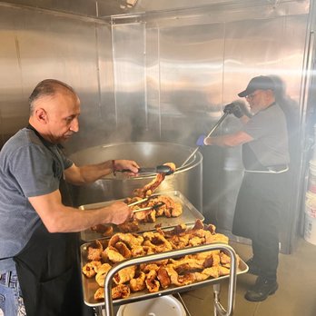 Zamora Bros Carnitas Y Chicharrones - two men cooking in a kitchen - Mexican Near Me - La Puente, California Zamora Bros Carnitas Y Chicharrones - two men cooking in a kitchen - Mexican Near Me - La Puente, California