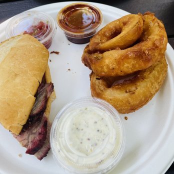 Cold Spring Tavern - Tri. Tip sandwich and onion rings, split between two people. - American Near Me - Santa Barbara, California