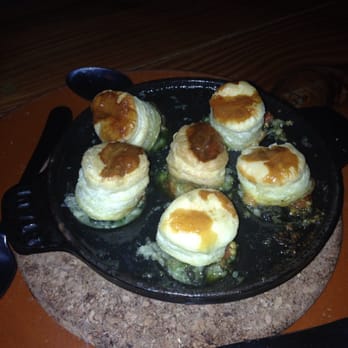 Barceloneta - Escargot with rabbit sausage with a tiny biscuit on top. Lovely delicate flavor. - Spanish Near Me - Miami Beach, Florida