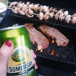 someone holding a can of somersby