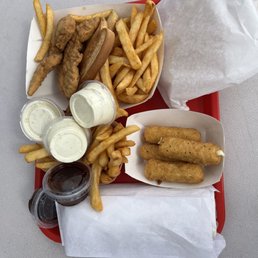 a tray of food including fries and a hot dog a tray of food including fries and a hot dog