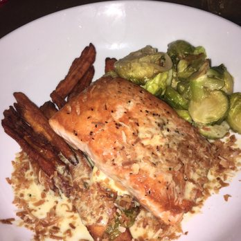 Omar's Carriage House - Pan Seared Salmon- curry sauce, coconut flakes, sweet potato fries, roasted Brussels sprouts! Yummm! - New American Near Me - Norfolk, Virginia Omar's Carriage House - Pan Seared Salmon- curry sauce, coconut flakes, sweet potato fries, roasted Brussels sprouts! Yummm! - New American Near Me - Norfolk, Virginia
