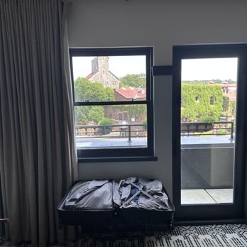 Lora - As you walk in, this is what you see ahead of you, windows a door to balcony. - Hotels Near Me - Stillwater, Minnesota