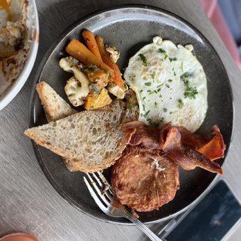 Prospect Gourmand - a plate of food on a table - New American Near Me - Beverly Hills, California