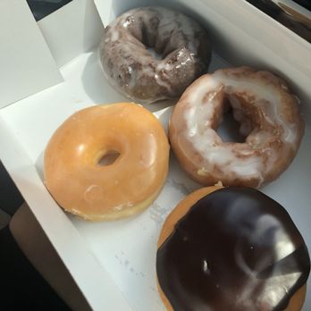 Wegmans - Top clockwise: chocolate cake, sour cream, Boston cream, plain glazed ($0.99 each) - Grocery Near Me - Chestnut Hill, Massachusetts
