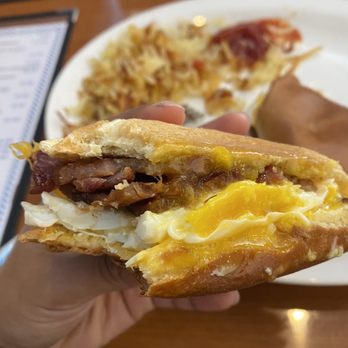 Three Little Birds Cafe - Breakfast sandwich with bacon and cheddar cheese - Cafes Near Me - Stuart, Florida Three Little Birds Cafe - Breakfast sandwich with bacon and cheddar cheese - Cafes Near Me - Stuart, Florida