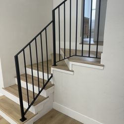 Metal Solutions Ironworks - Interior stair railing, matte black, tricky angle with minimal posts