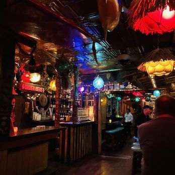 Foundation Bar - a man sitting at a bar - Tiki Bars Near Me - Milwaukee, Wisconsin