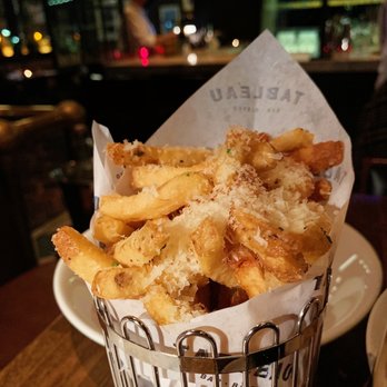 Tableau Bar Bistro - a basket of french fries - Bars Near Me - Vancouver, British Columbia