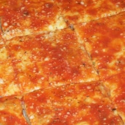 Sausage pizza. a layer of fresh homemade sausage is under cheese and sauce.