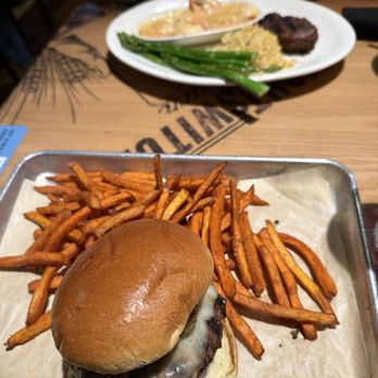 BJ's Restaurant & Brewhouse - Crispy Jalapeño Burger with Sweet Potato Fries & Tri-Tip with Shrimp Scampi, Asparagus and Rice - Pizza Near Me - Modesto, California
