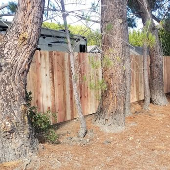 J & A Landscape - a wooden fence with a truck in the background - Landscaping Near Me J & A Landscape - a wooden fence with a truck in the background - Landscaping Near Me