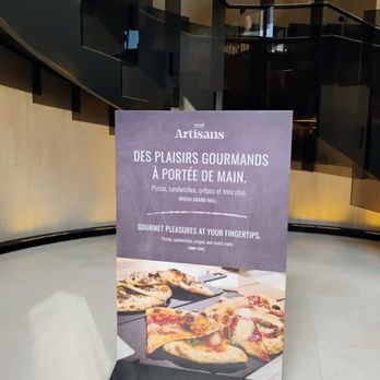 MARCHÉ ARTISANS - If you're coming from the RESO Underground Path you'll need to go up the spiral staircase to get to the Market. - Public Markets Near Me - Montreal, Quebec