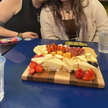 Foodies - two women sitting at a table in a grocery store - Cafes Near Me - Auburn, Alabama Foodies - two women sitting at a table in a grocery store - Cafes Near Me - Auburn, Alabama