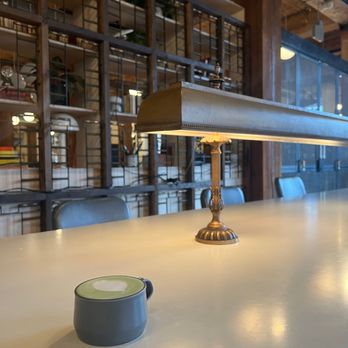 Electrica Coffee - Community Table (plugs underneath), Matcha Latte with Oat Milk - Coffee & Tea Near Me - Portland, Oregon