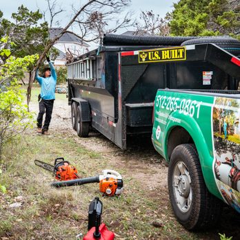 Tree Scouts - Throwing a tree into our tree scouts tree service dump trailer - Tree Services Near Me - Georgetown, Texas