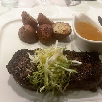 Bistango in Irvine - Prime Angus NY Strip- Thyme garlic rosemary potatoes, green peppercorn sauce. $57 - American Near Me - Irvine, California Bistango in Irvine - Prime Angus NY Strip- Thyme garlic rosemary potatoes, green peppercorn sauce. $57 - American Near Me - Irvine, California