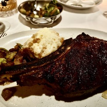 Durant's - Bone-In Ribeye, 22oz, wet aged, not great, dry, bland. Side of Brussels (not great) and scalloped potatoes (excellent). - Steakhouses Near Me - Phoenix, Arizona