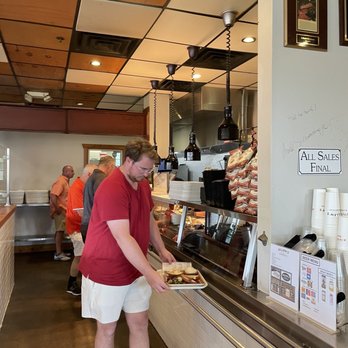 Killen's Barbecue - a man serving food - Barbeque Near Me - Pearland, Texas Killen's Barbecue - a man serving food - Barbeque Near Me - Pearland, Texas