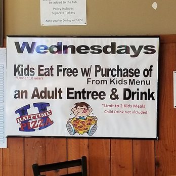Halftime Pizza - a restaurant with a menu on the wall - Pizza Near Me - San Antonio, Texas