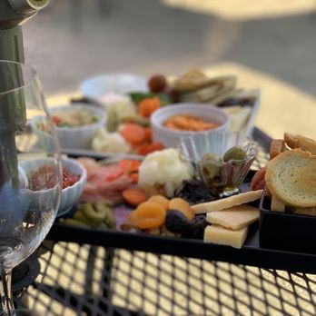 Edenvale Winery - a glass of wine and a platter of appetizers - Venues & Event Spaces Near Me - Medford, Oregon