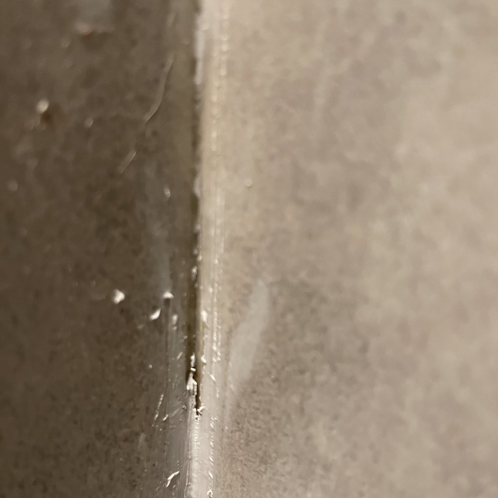 Caulked over old, moldy caulking Caulked over old, moldy caulking