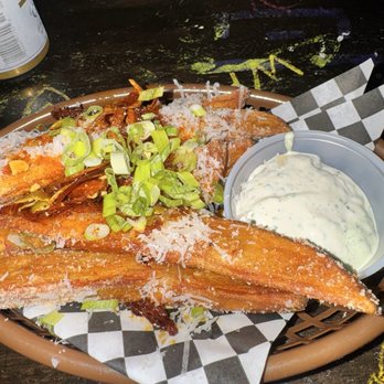 Montana Badlands - Loaded potato wedges - Bars Near Me - Seattle, Washington Montana Badlands - Loaded potato wedges - Bars Near Me - Seattle, Washington